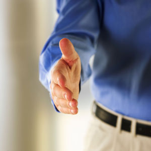 Man extending arm for handshake