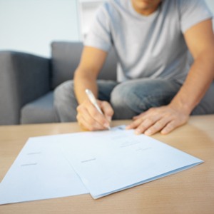 Man filling out forms