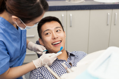 Dental hygienist with patient