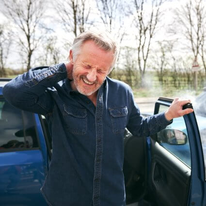 Man in pain after car accident