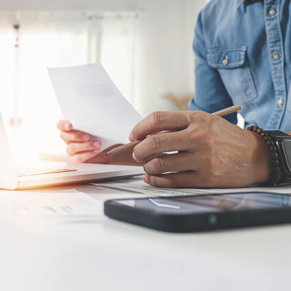 man filling out paperwork