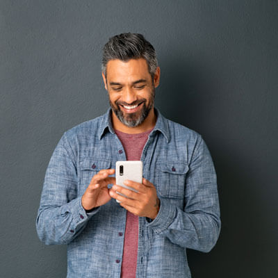 Man on phone by wall