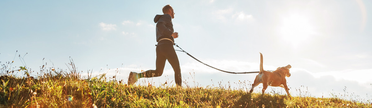 Man running with dog