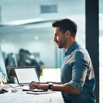 man sitting up straight at desk