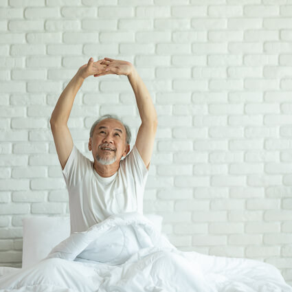 Smiling woman in bed
