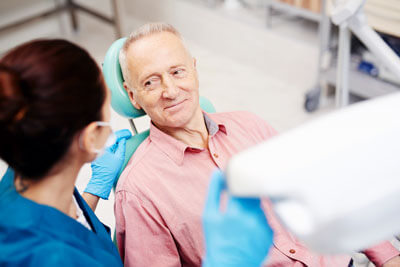 Man talking with dental technician