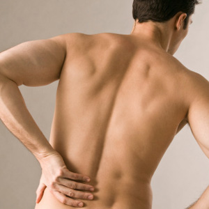 Man holding low back in pain