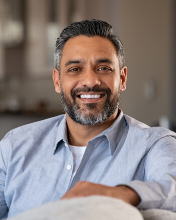 Smiling man wearing blue shirt