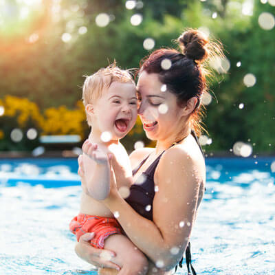 mom and baby splashing