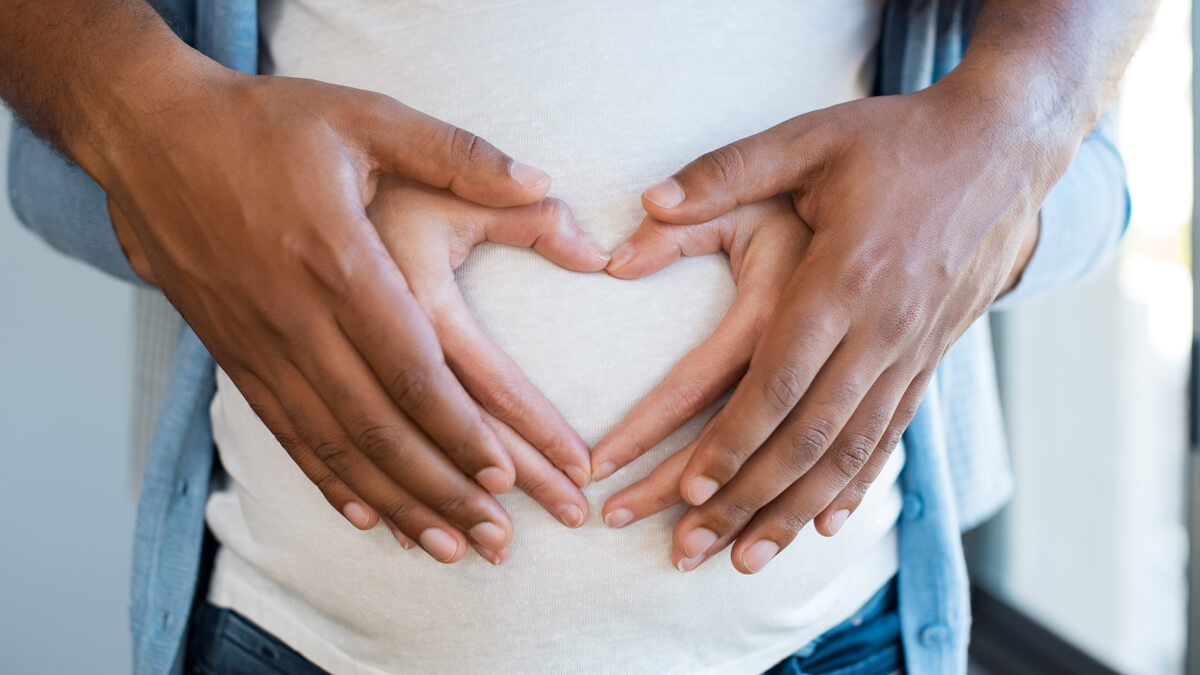 Heart hands on belly