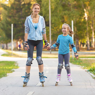 Mom and daughter roller blading