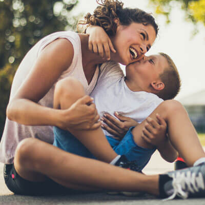 mom and little boy smiling