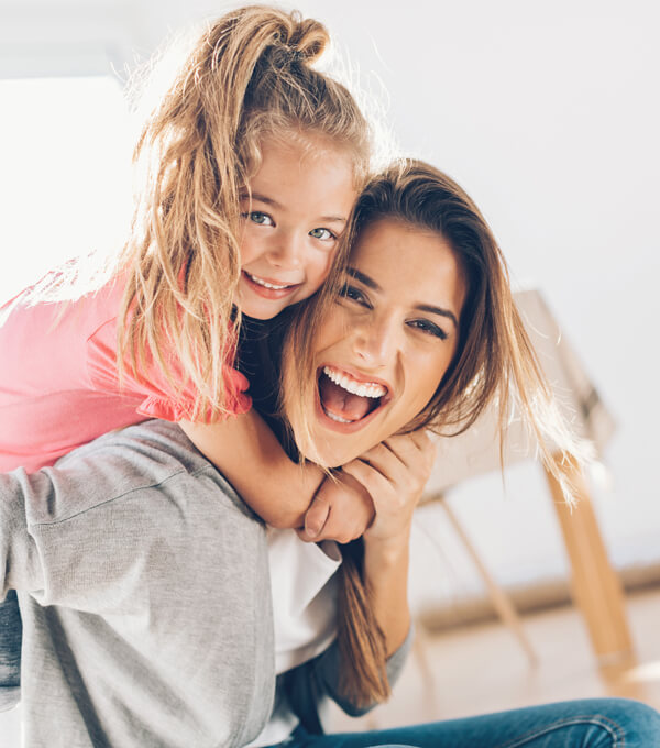 mom and daughter laughing