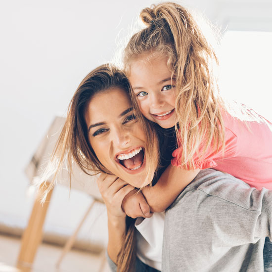 mother and daughter smiling