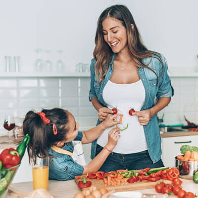 mother and daughter cooking