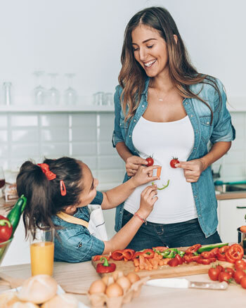 mother and daughter cooking