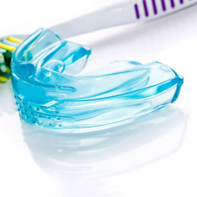 mouthguard and toothbrush