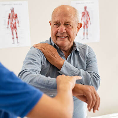 older man showing shoulder pain