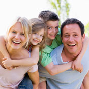 Family of four smiling