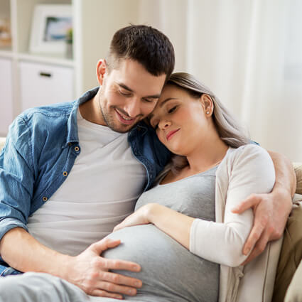 Pregnant woman on couch