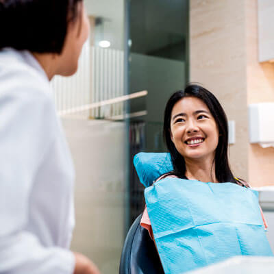 woman smiling in dentist chair