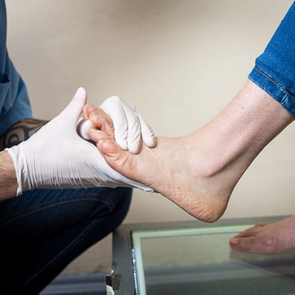 Foot exam for neuropathy symptoms