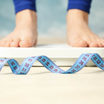 person standing on a scale
