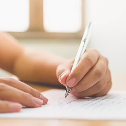 Woman filling out paperwork