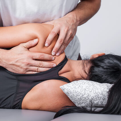 Hand on woman's shoulder