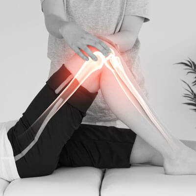 CGI of physical therapy session with a glowing knee