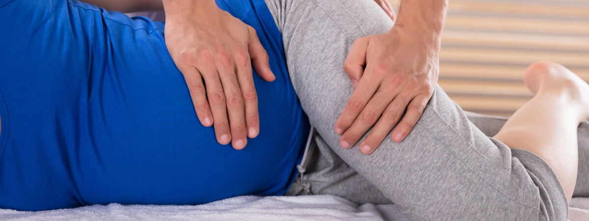 Chiropractor adjusting a pregnant woman