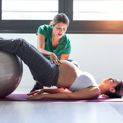 pregnant mom on physiotherapy ball