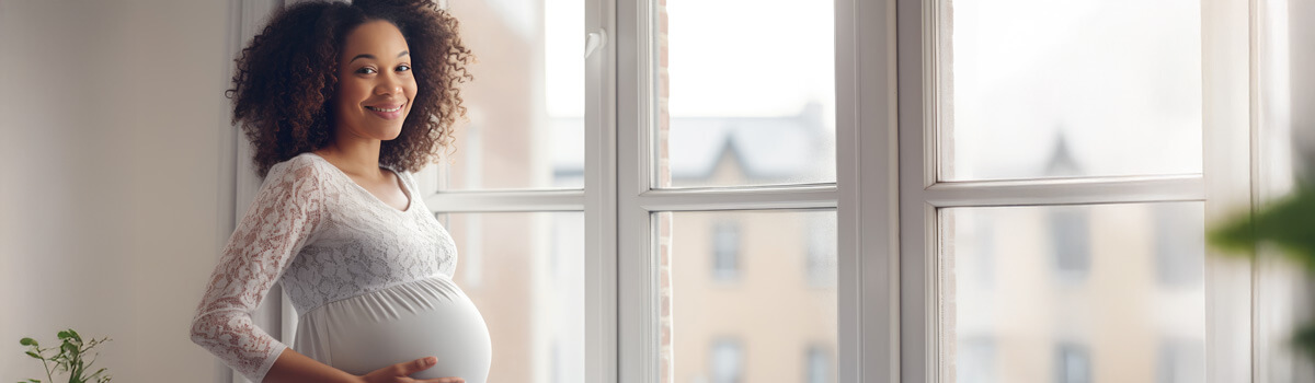 Pregnant woman by window