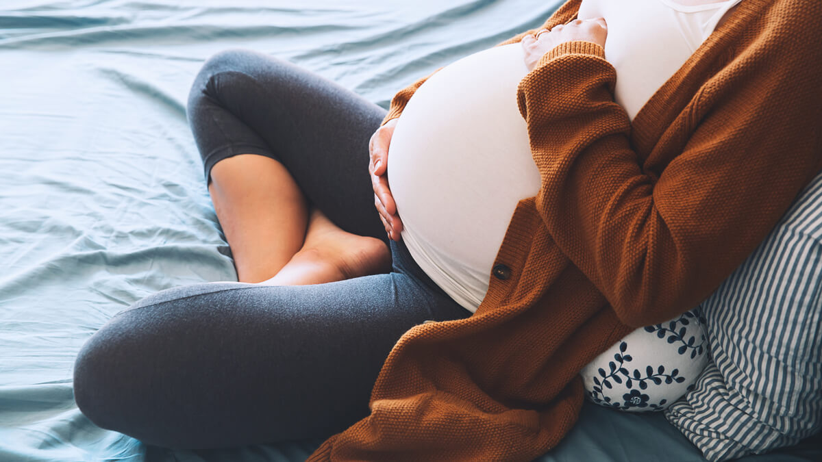 Pregnant woman sitting with back support