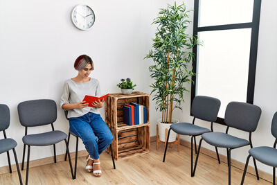 Female patient sitting in waiting room