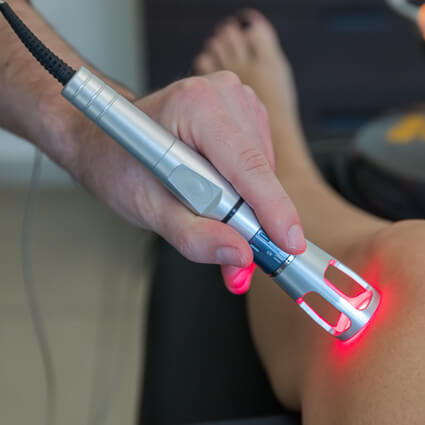 laser tool on persons knee