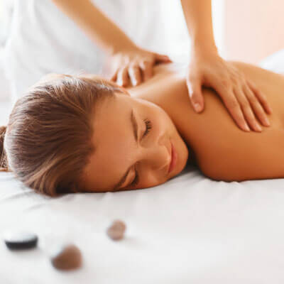 A woman receiving a relaxing masage