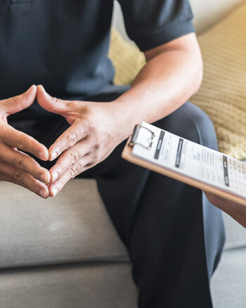 Patient in consultation with a chiropractor
