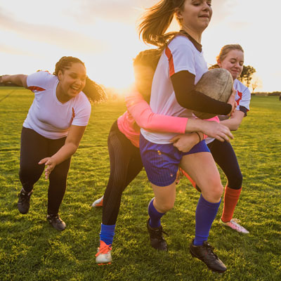 Girls playing rugby