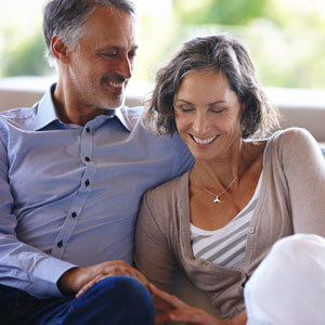 Happy couple sitting on couch