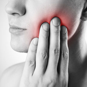 Woman with severe jaw pain