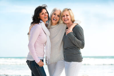 Smiling ladies on a beach