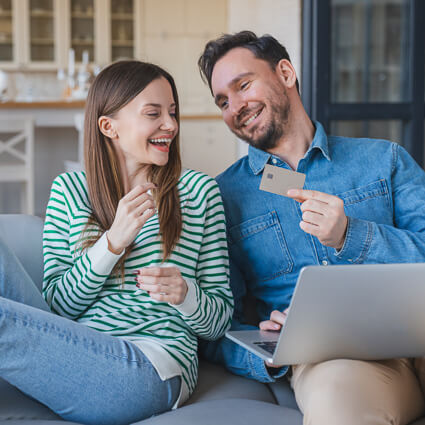 Couple holding credit card