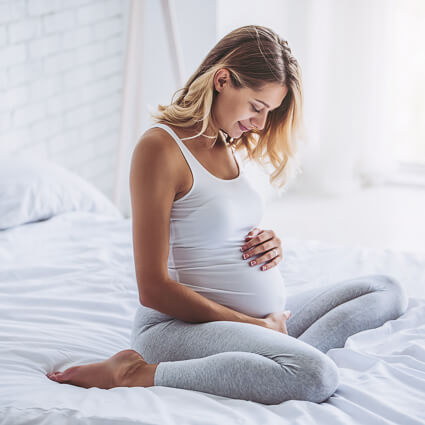 Pregnant woman in bed