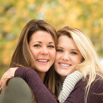 Smiling sisters in fall