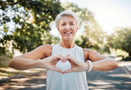 Woman making heart with hands