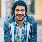 Young man wearing ski hat and hoodie