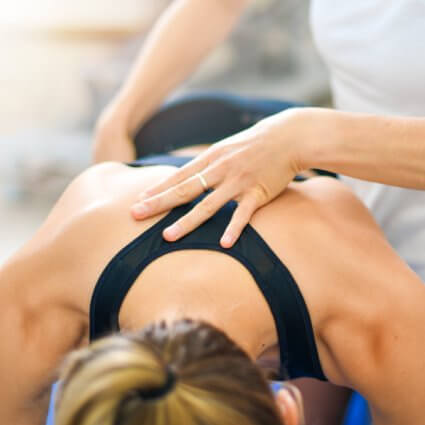 woman laying down getting back massage