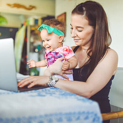 Woman and baby on computer