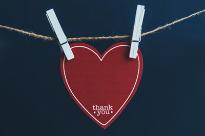 Paper heart hanging on string